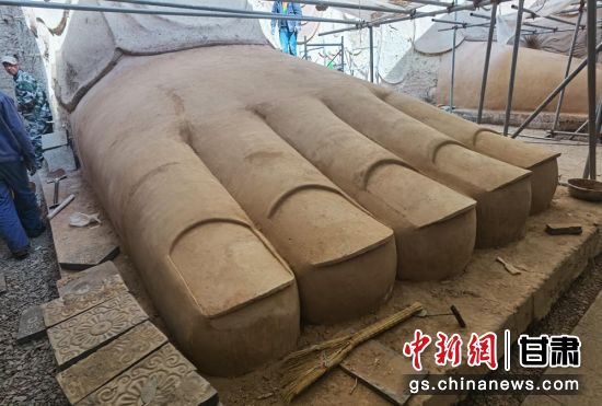 圖為中國“石窟鼻祖”天梯山石窟第13窟大佛足部與局部危巖體搶救性保護項目施工現場。陳曉斌 攝 圖為中國“石窟鼻祖”天梯山石窟第13窟大佛足部與局部危巖體搶救性保護項目施工現場。陳曉斌 攝